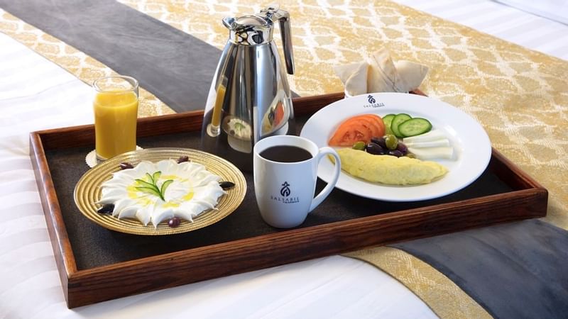 Breakfast meal served with beverages in Family Suite at Warwick Hotel Jeddah