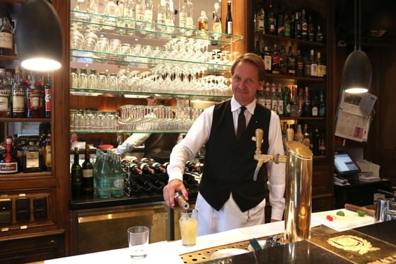 A Bartender making drinks at Hotel Palace Munich