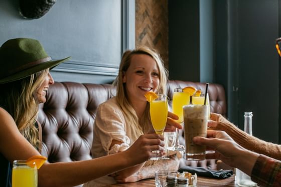 Ladies enjoying mimosas & latte in a Restaurant at Adara Hotel