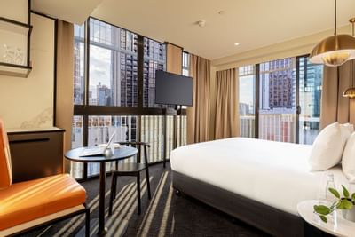 King bed & TV in business room at Brady Hotels Jones Lane
