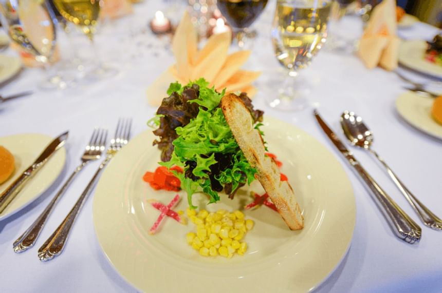 A garnished dish & cutlery at Kellogg Conference Center