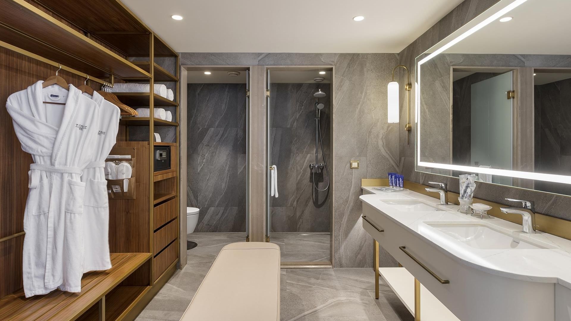 Junior Sea View Suite, bathroom with vanity, shower stall and robes at Titanic Port Bakirkoy