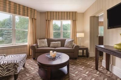 TV lounge by the window in 1 King Bed One Bedroom Executive Suite at Spencer Hotel, offering best hotel suites London Ontario