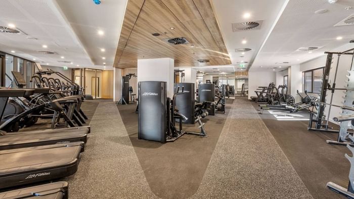 Modern gym and fitness center with various equipment at UniLodge Brisbane City.