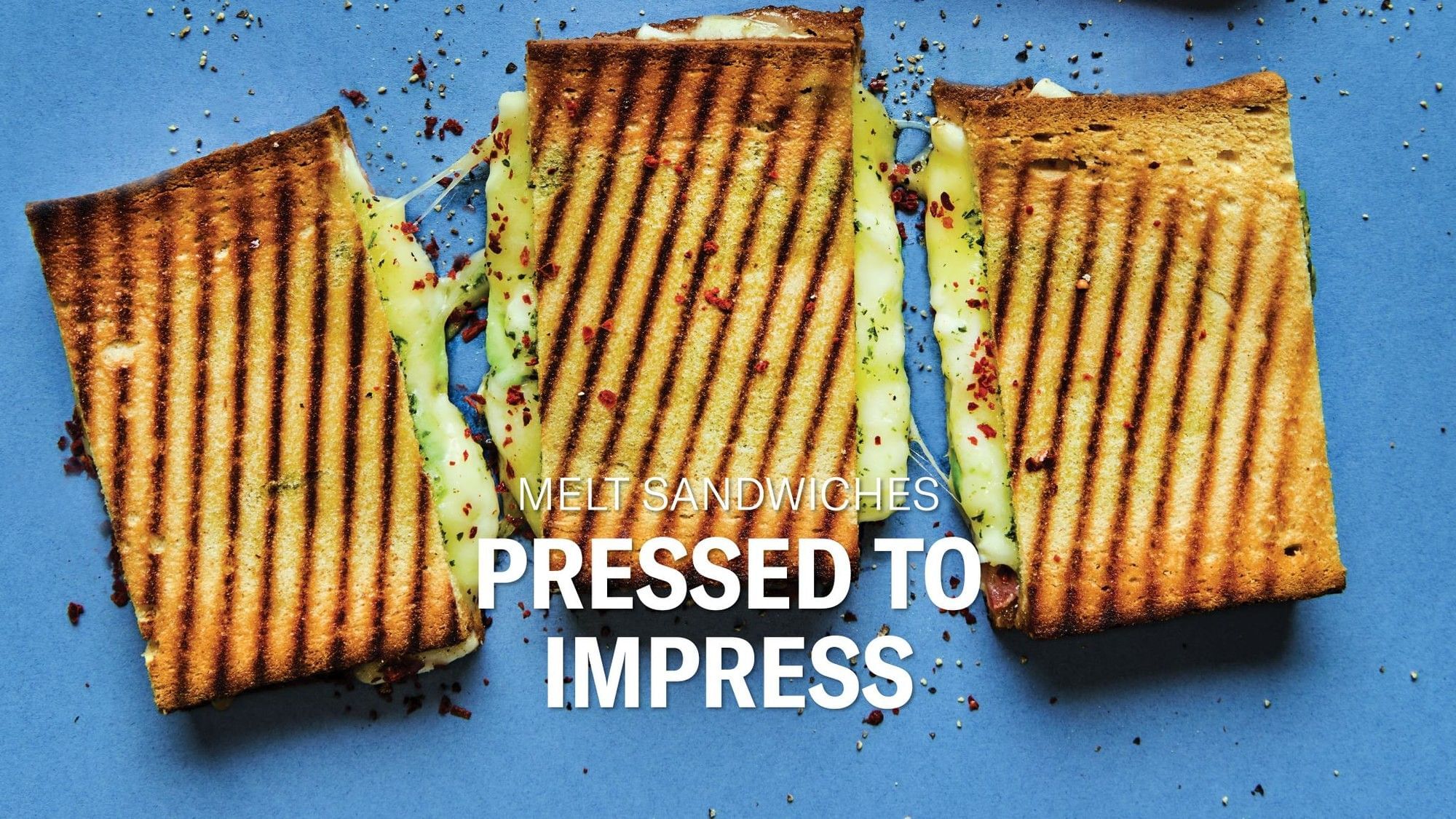 Three perfectly grilled cheese melt sandwiches with gooey cheese, 