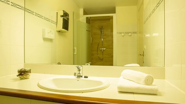 Bathroom vanity in bedrooms at Hotel Clos Sainte Marie