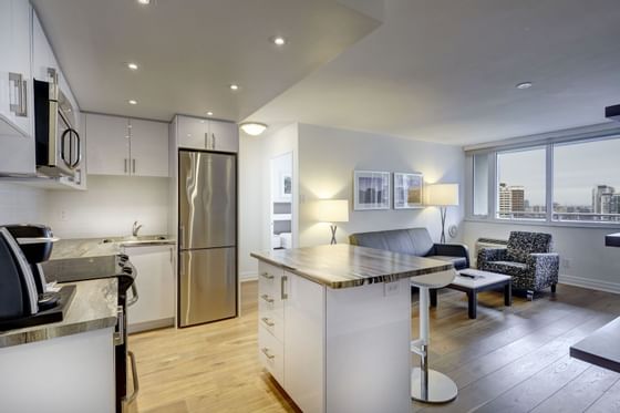 Kitchen & living room area in Luxury King Suite, one of the best hotel suites in Toronto at Town Inn Suites