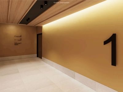 Empty hallway with a yellow wall, white tiled floor, and number 1 at UniLodge Brisbane City.