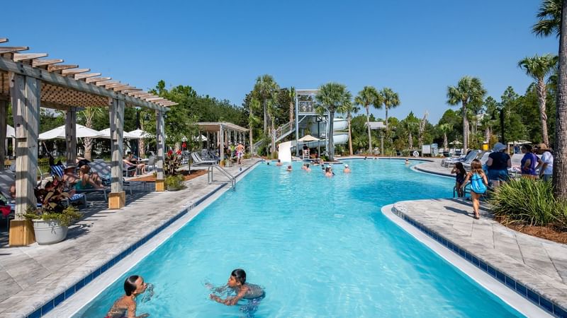 People swimming and Lounging in a pool at WaterColor Inn