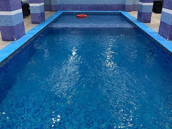 Indoor swimming pool with clear water at Naviti by Warwick Al Khobar