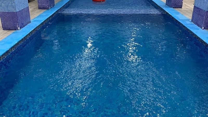 Interior of indoor pool with clear water at Warwick Hotels and Resorts