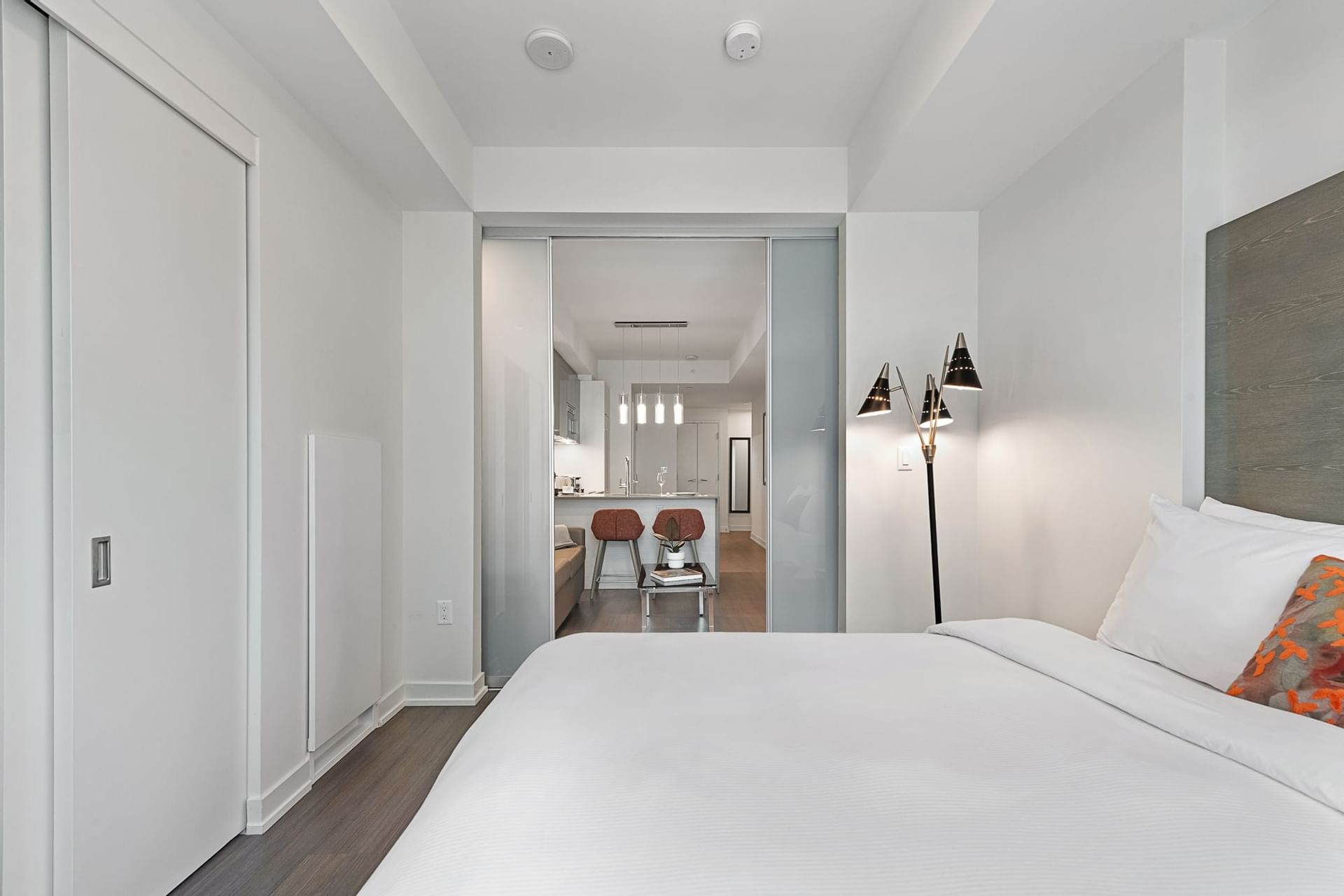 Bed & dinning area of one-bedroom suite at ReStays Ottawa