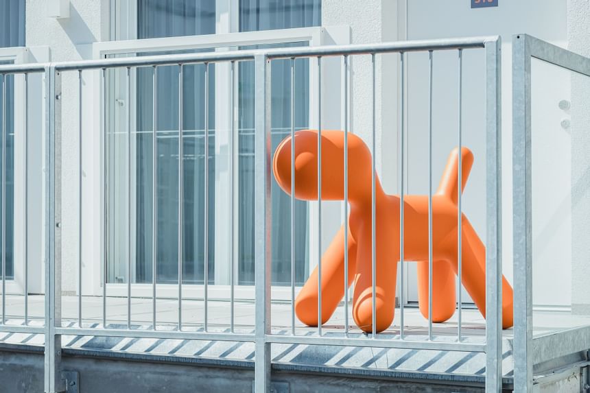 A toy dog placed in a balcony at Oliver Like Home