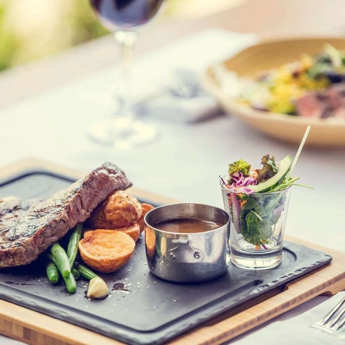 Closeup of meals served with wine at Darwin Airport Hotels