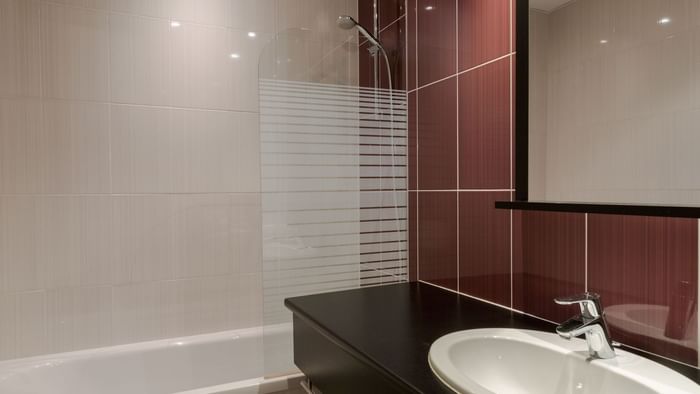 Bathroom vanity in bedrooms at Hotel des Lys