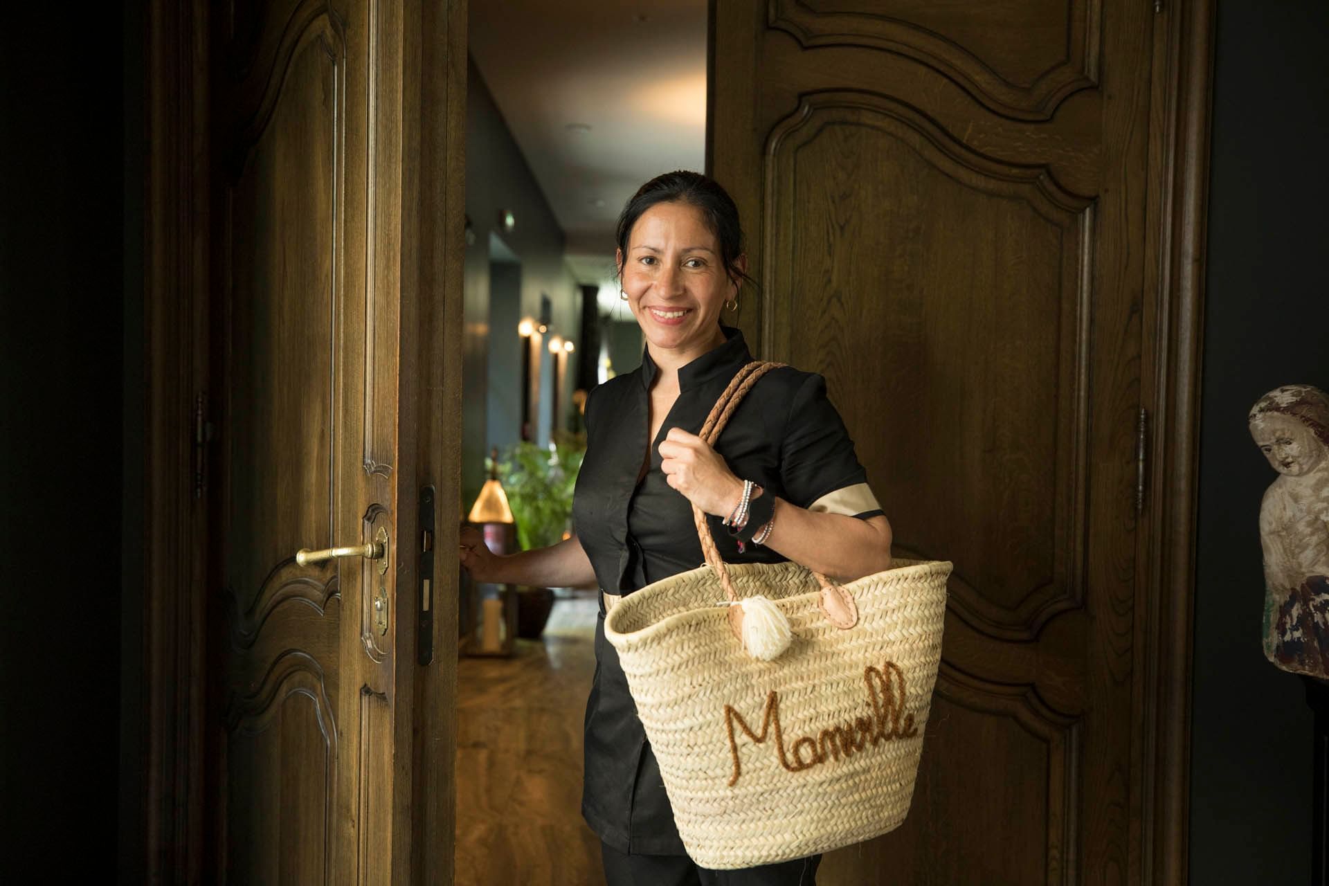 Hotel Staff Member holding her bag at Domaine de Manville