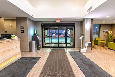 Hotel entrance by the front desk at Encore Suites Grande Prairie