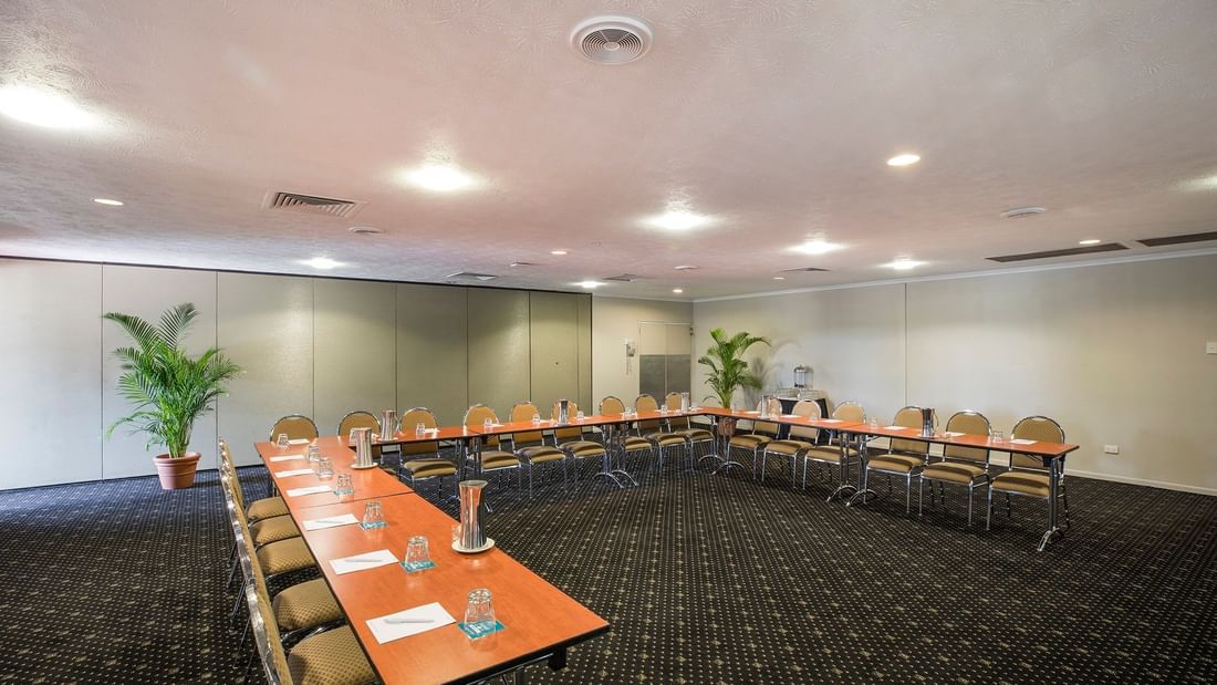 Interior of Eacham Room with u-shape table setup and chairs at Mercure Hotel Townsville