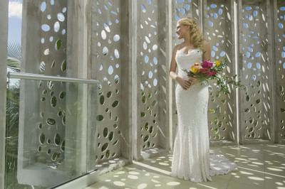 A Bride holding a Flower Bouquet at El Blok Hotel  