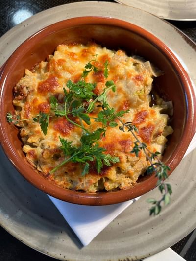 Baked casserole served in Osteria 31, one of the best restaurants in Lausanne at Starling Hotel Lausanne