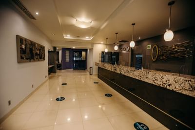 Hallway by the lobby reception area at Araiza Hotel Calafia