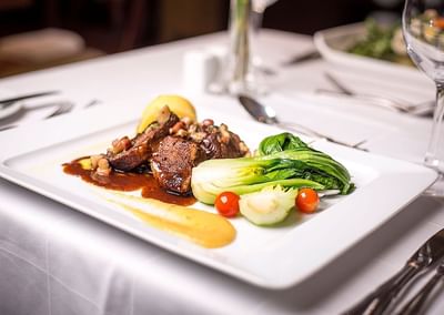 Close-up of a served beef dish at Hotel Plaza San Francisco