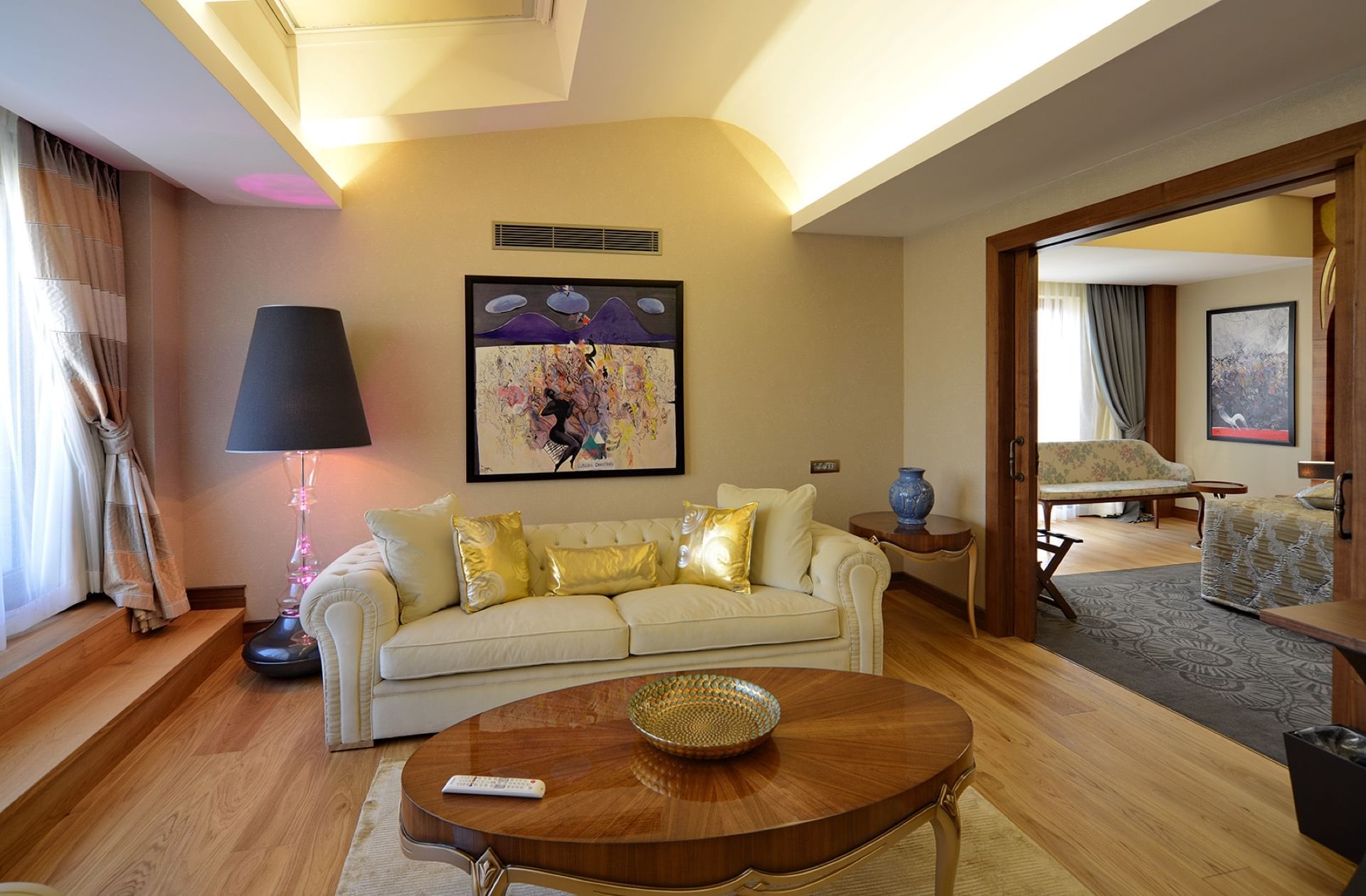 Lounge area with comfy furniture & wooden floors in a Room at Warwick Ankara