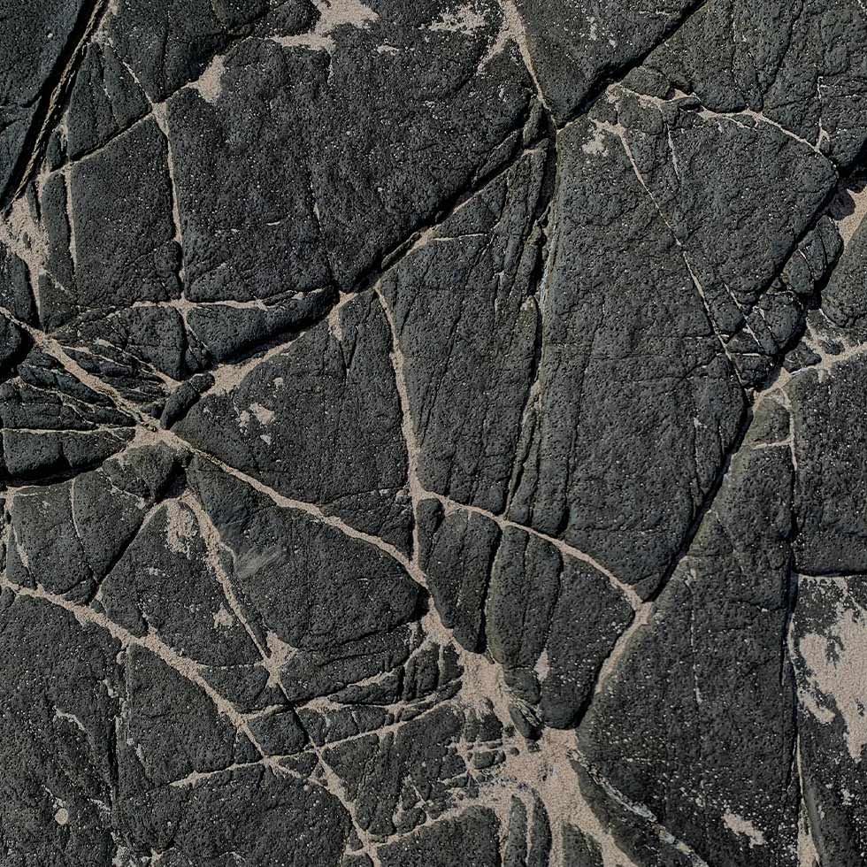 Close-up of a cracked stone texture at Falkensteiner Hotels