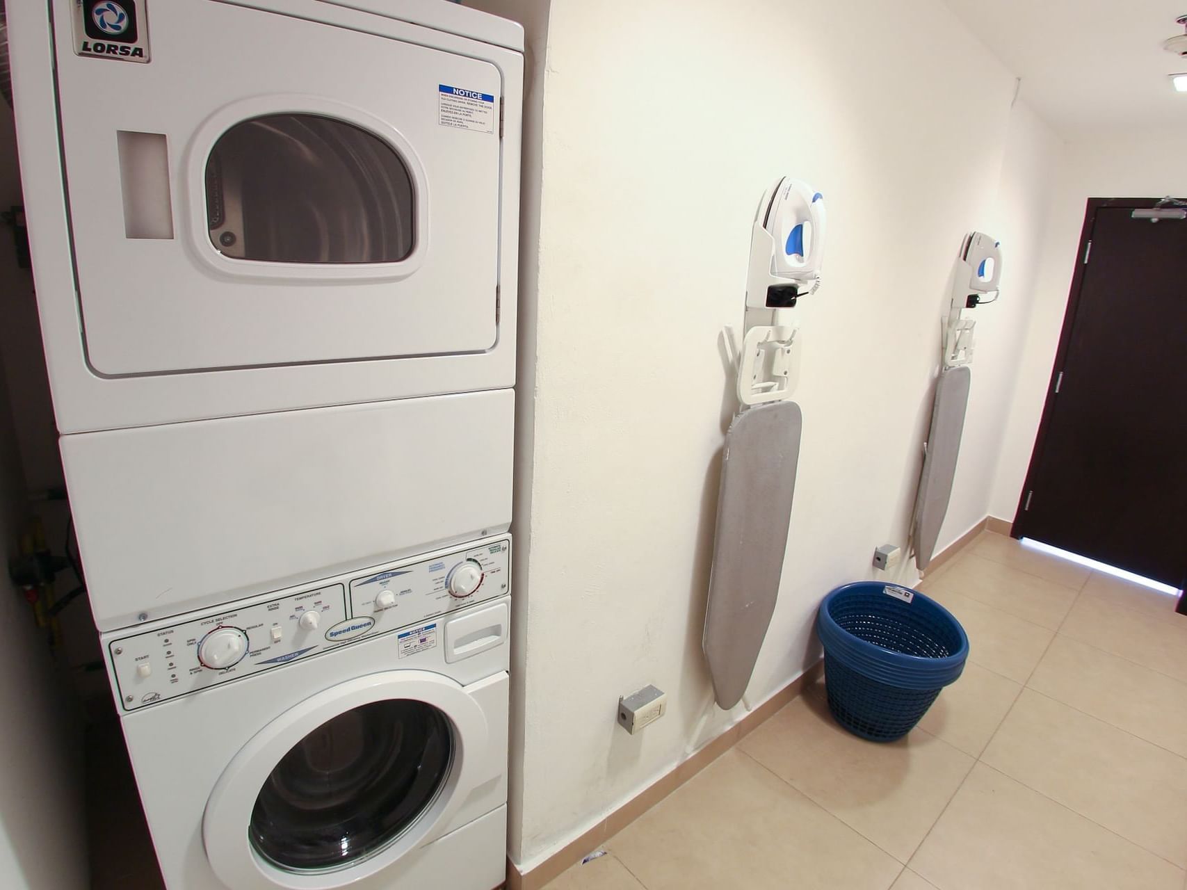 Washing machine & ironing boards in Laundry Room, One Hotels