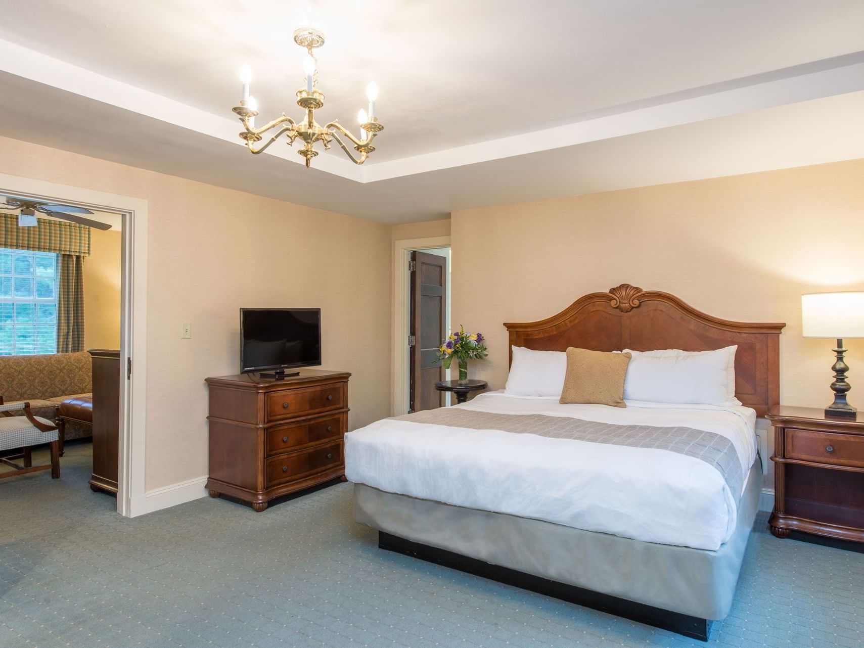 TV & King bed in Jacuzzi Suite at The Exeter Inn