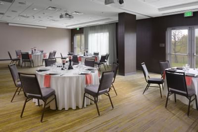 banquet hall with circular tables set up for event