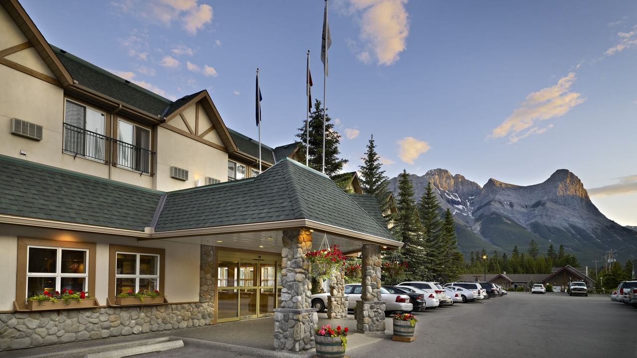 The exterior of Coast Canmore Hotel & Conference Centre with clear blue sky.