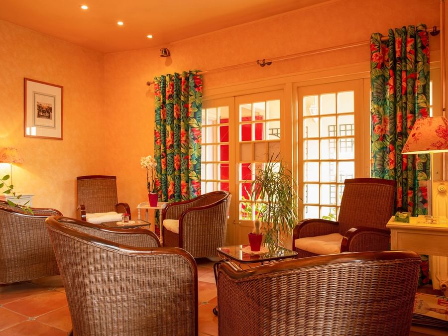 A living room with furniture at Hotel Clos Sainte Marie