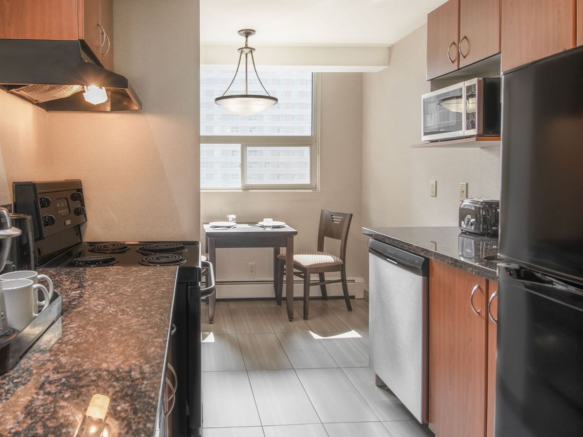 Hotel suite with kitchen and dining area