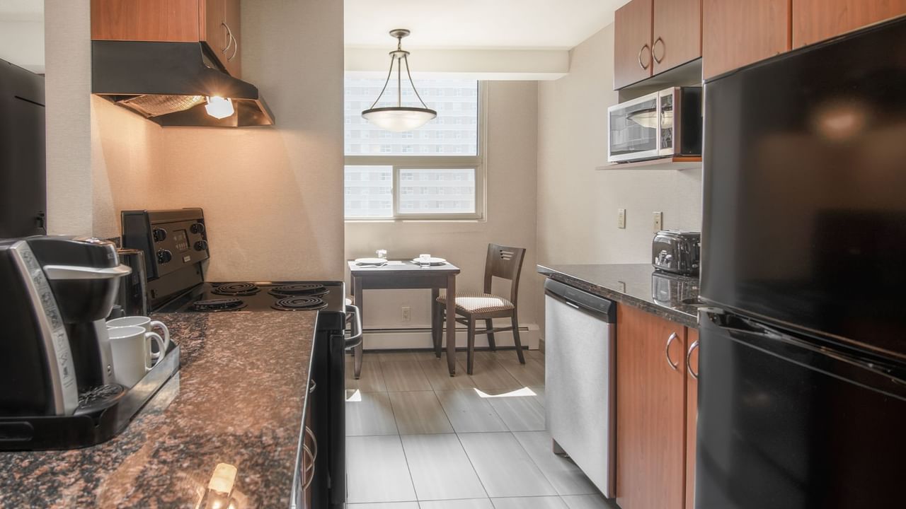 Hotel suite with kitchen and dining area