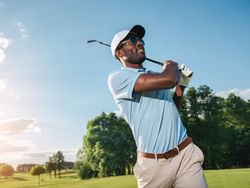 A man playing golf at Avalon Golf Club near ICONA Windrift