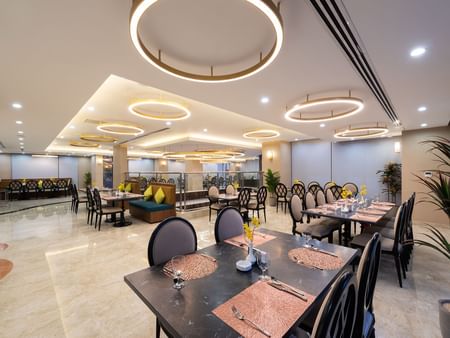 Elegant dining area featuring dining tables in Al Meer Restaurant at Warwick Riyadh