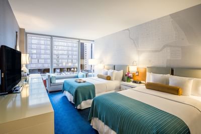 Two beds in Deluxe City View Double Queen Room at Kinzie Hotel