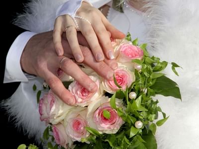Close-up of a bride and groom's hands with wedding rings at Starling Hotel Lausanne