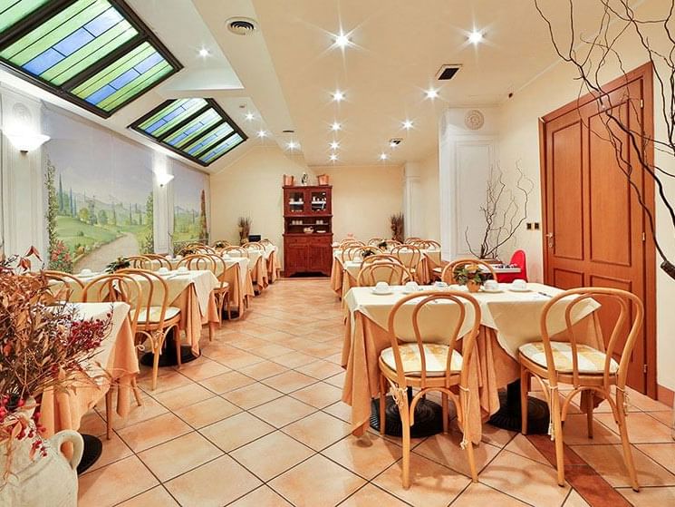 Dining tables arranged in Breakfast Room at Hotel Mozart