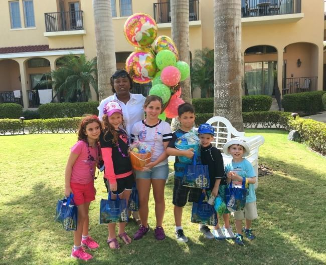 Kids posing an image, balloon seller, The Somerset On Grace Bay