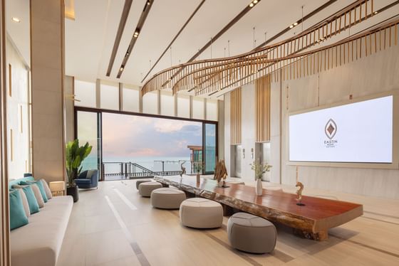 Interior of lobby area with wooden accents and sleek furniture at Eastin Resort Rayong