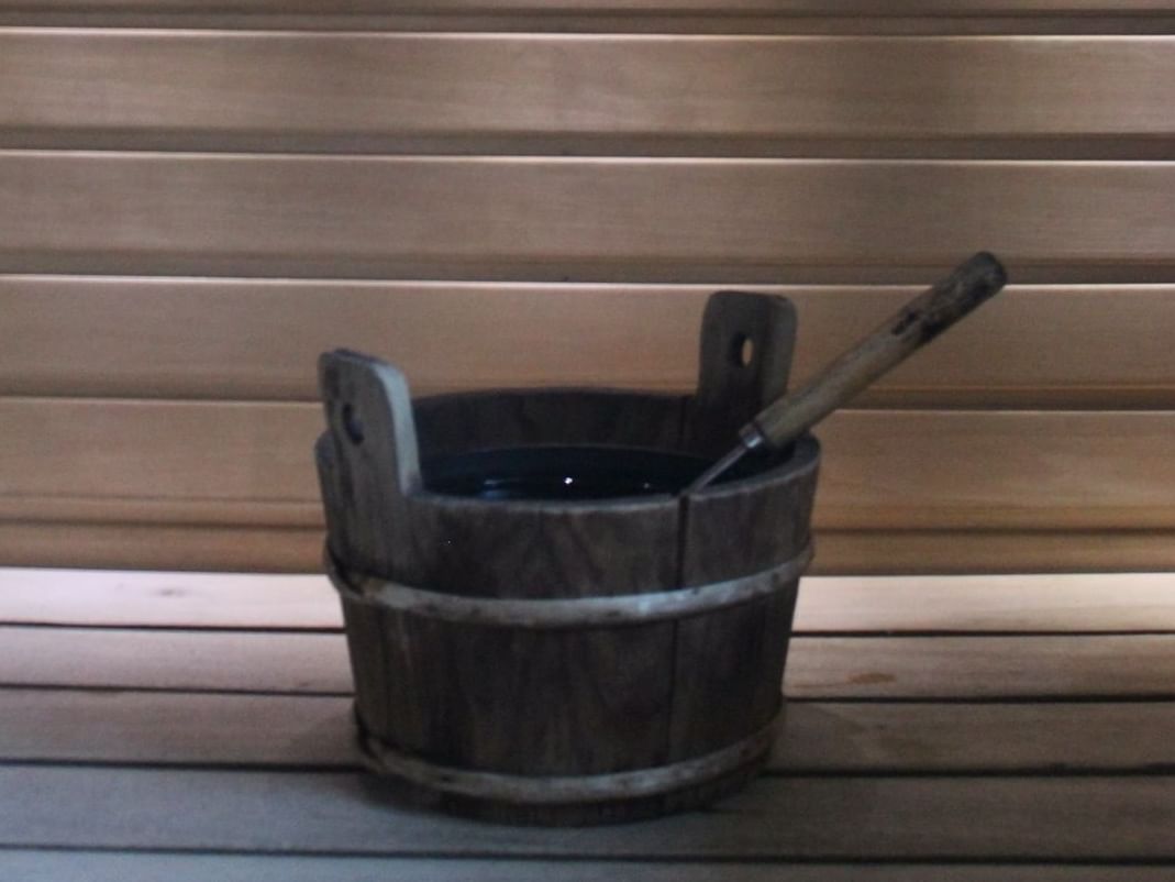A wooden pail in the Sauna at Atlantica Hotel Halifax
