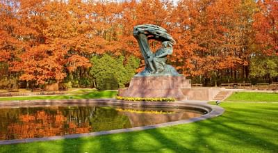 Statue around with lake and greenery nature near Polonia Palace Hotel in the summer