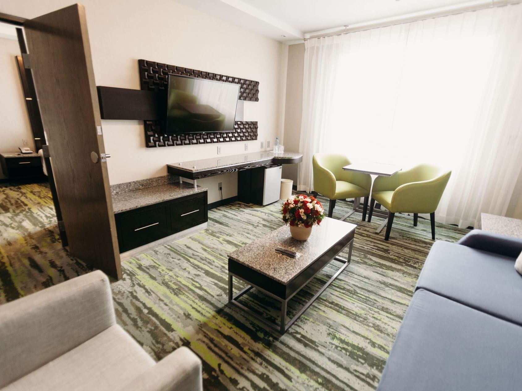 TV & lounge area in a Suite at Araiza San Luis