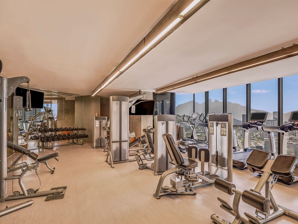 Fitness training equipment & dumbbell rack in the gym at Live Aqua Resorts and Residence Club