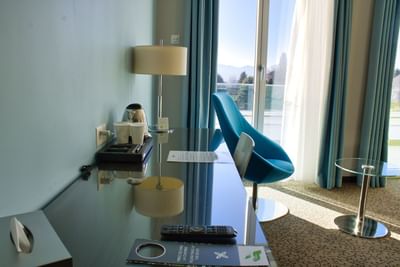 Interior of Family Superior Room with a work desk & lounge at Starling Hotel Lausanne accommodation