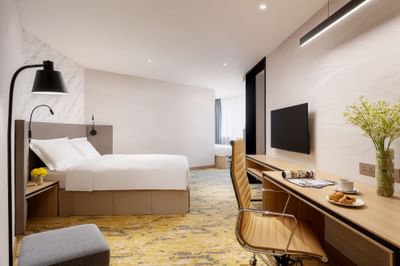 Work desk & TV by the bed in Premier Family Quintuple Room at Park hotel Hong Kong