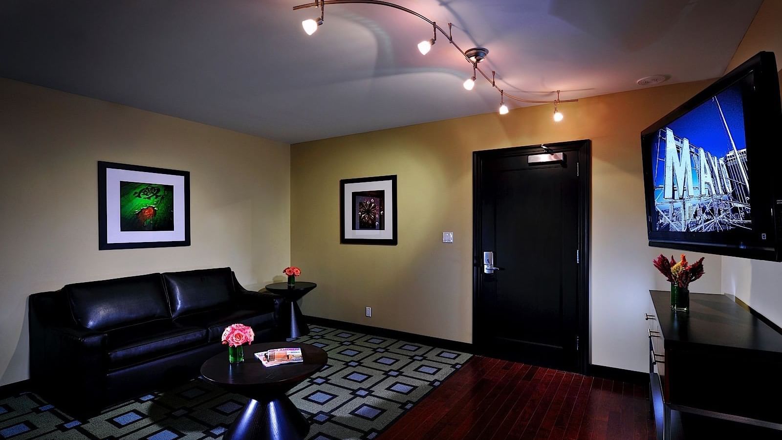 Living area with TV in Mayo Suite at The Mayo Hotel