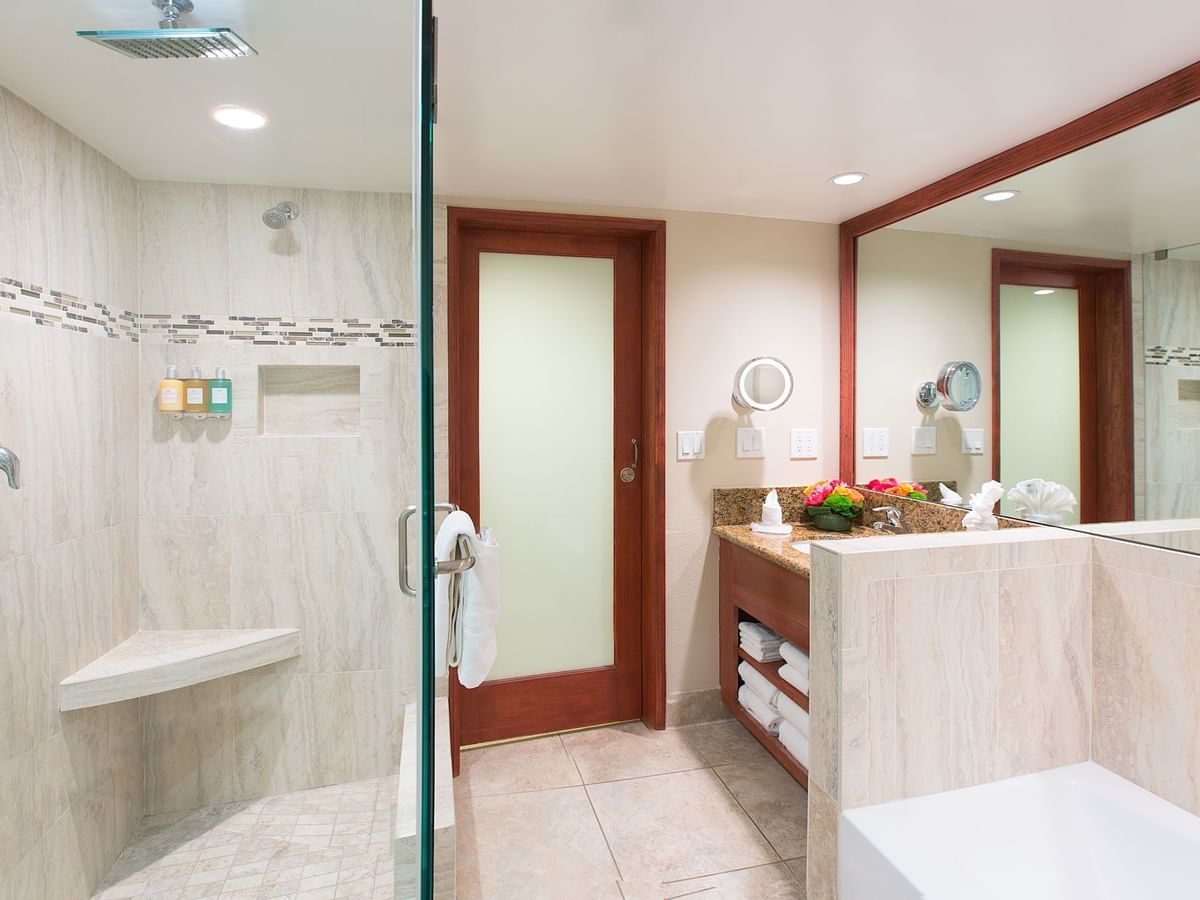 Shower, bathtub and sink in modern bathroom